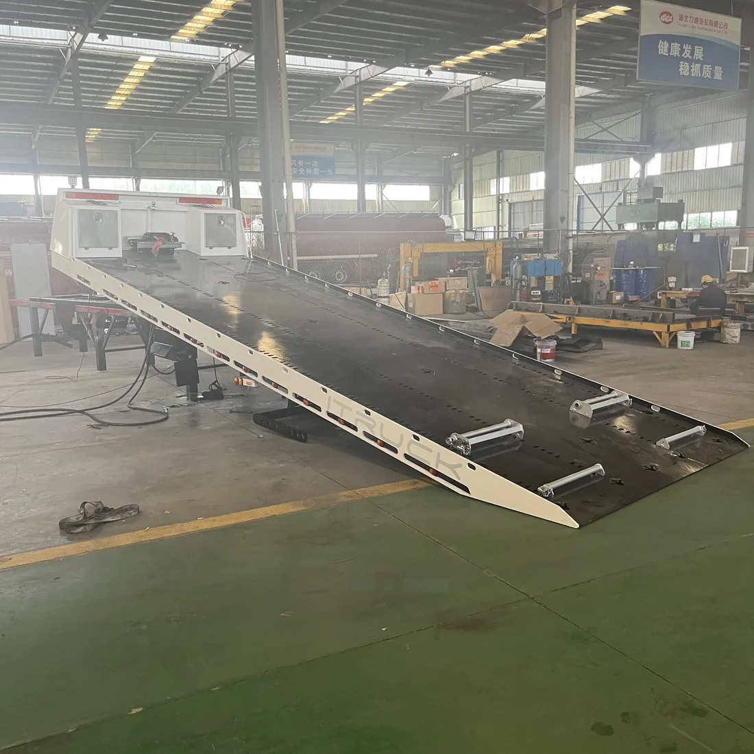 Australian tilt-tray flatbed at load angle