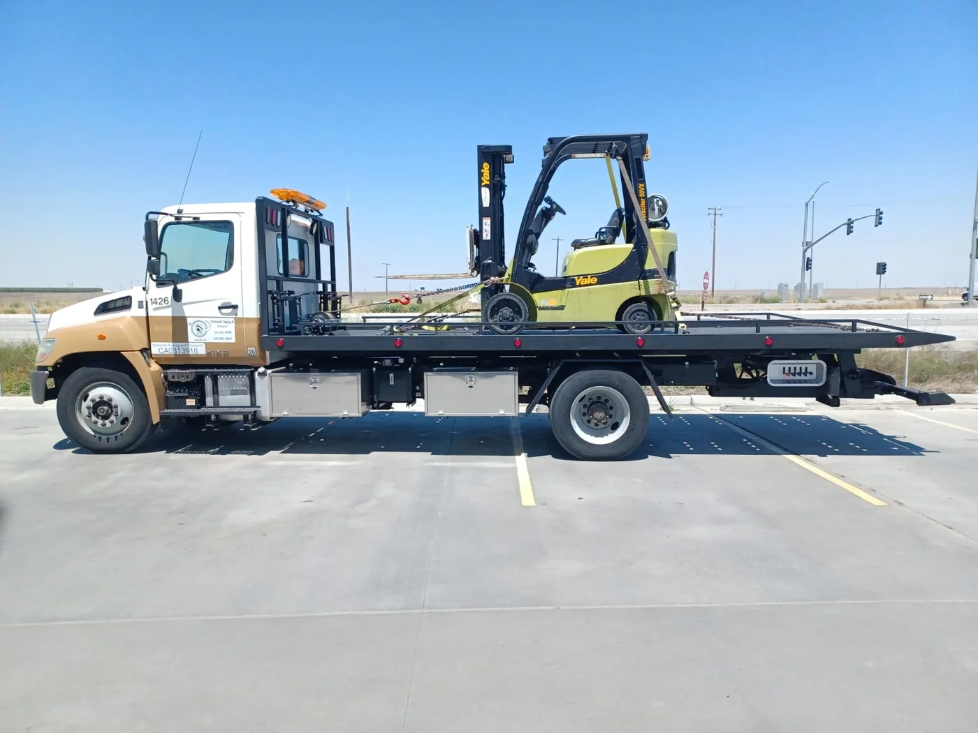 USA-style flatbed carrier tow truck