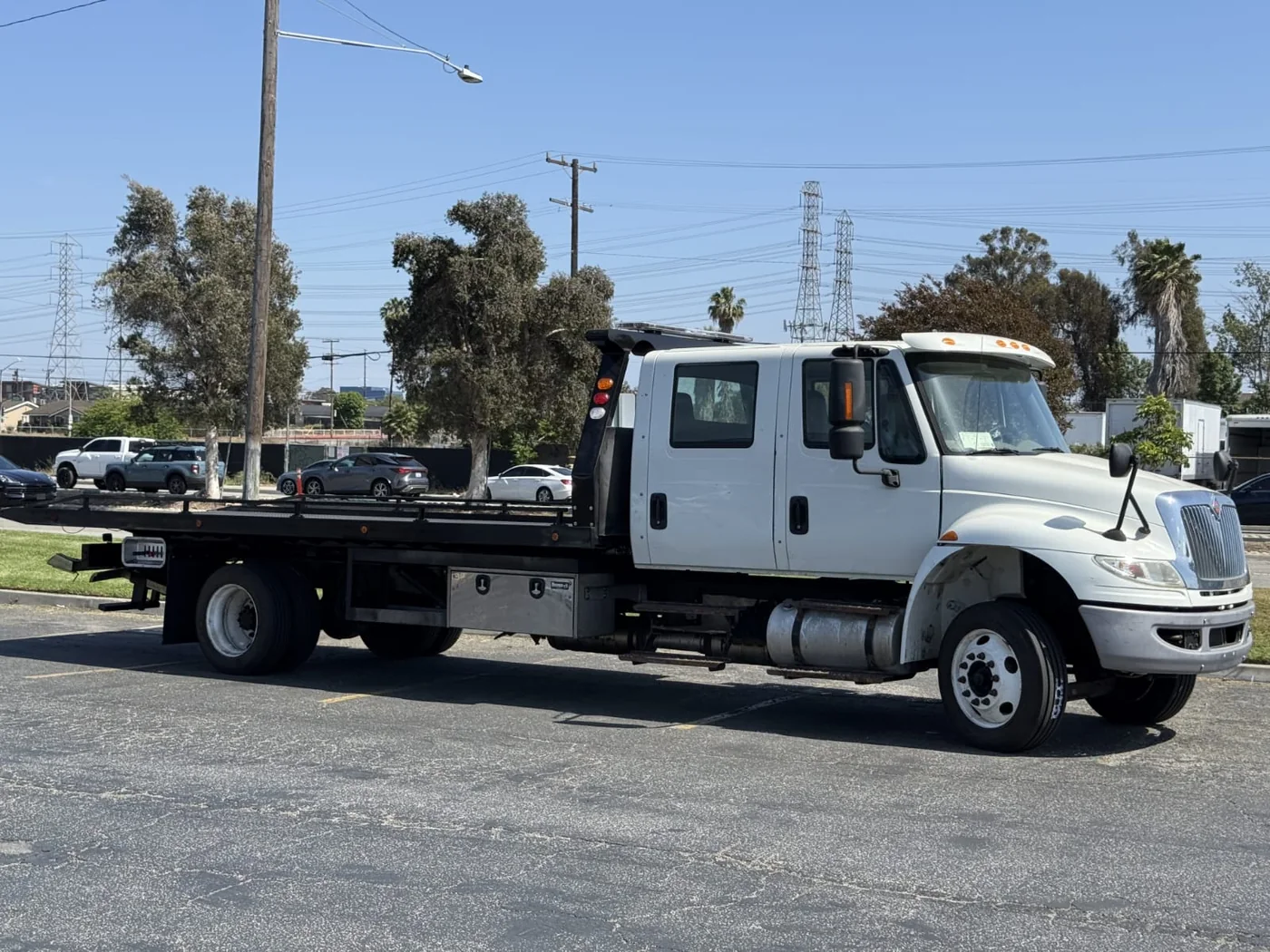Flatbed carrier truck, three-quarter view