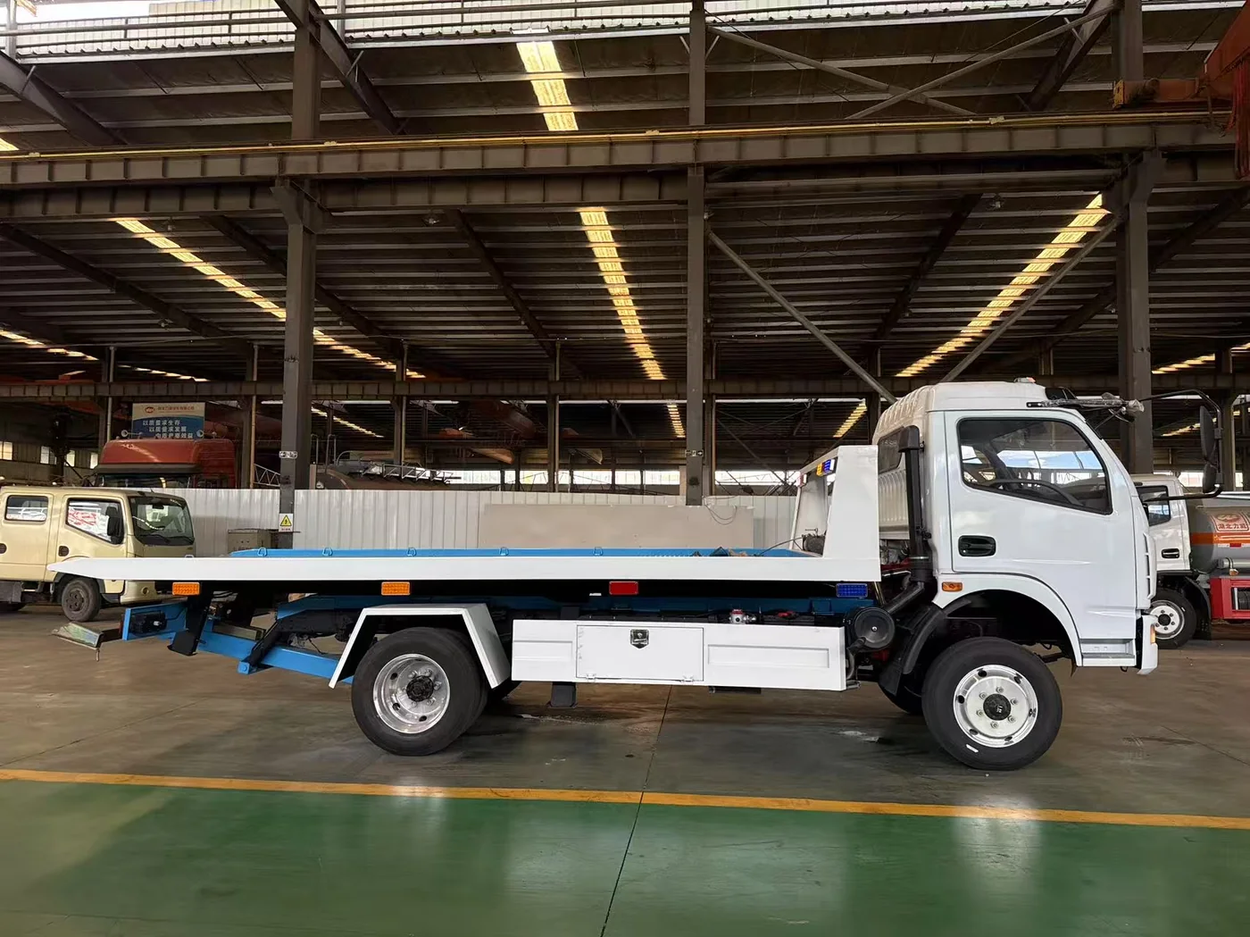 Flatbed carrier tow truck, side view