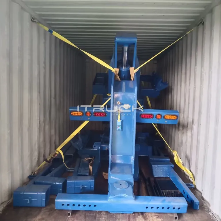 Heavy fifth wheel wrecker strapped inside a shipping container