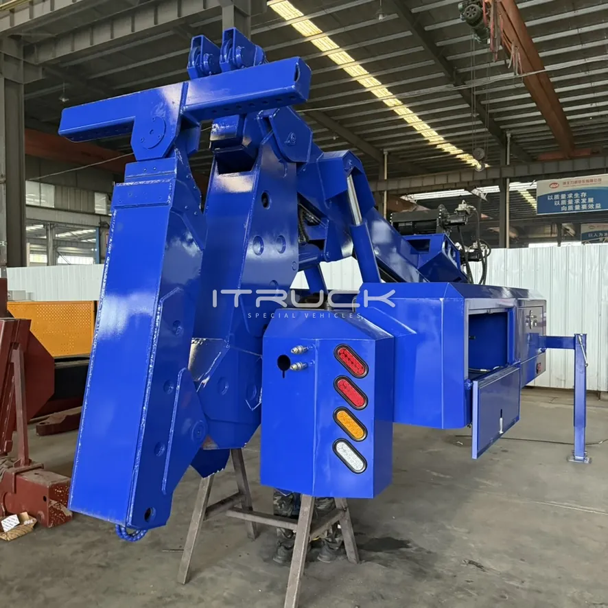 Blue detachable tow unit on stands with boom and underlift stowed