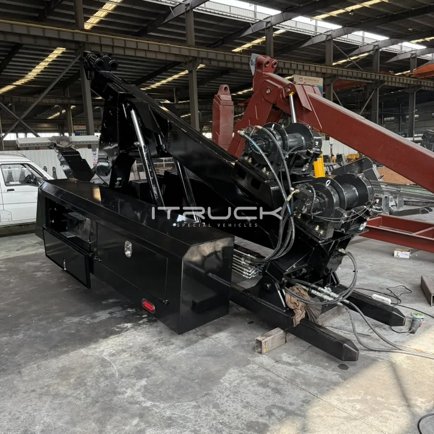 Black DTU body with toolboxes and winches behind the boom