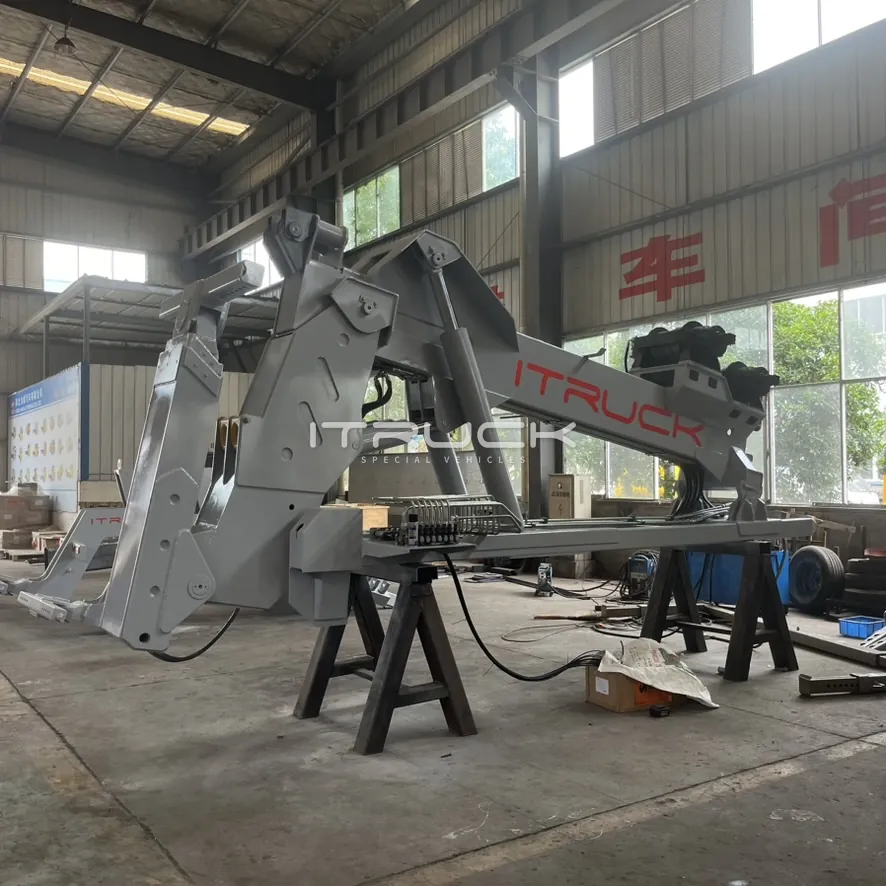 Grey heavy detachable tow unit on stands, boom and underlift stowed