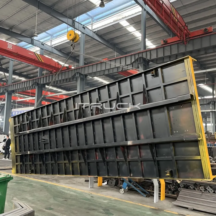 Heavy flatbed deck frame stood upright in the workshop