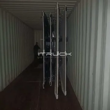 Flatbed beds loaded upright in a container