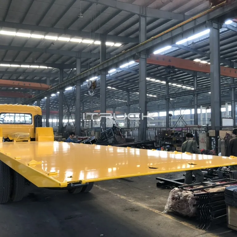 Flatbed deck fitted to a chassis in the workshop