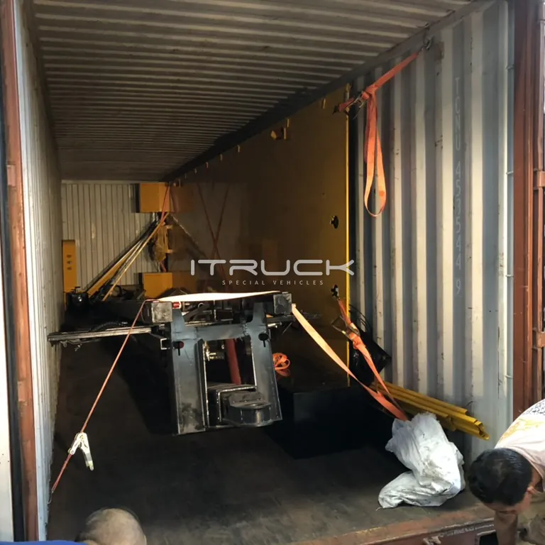 Deck, wheel lift and parts loaded in one container