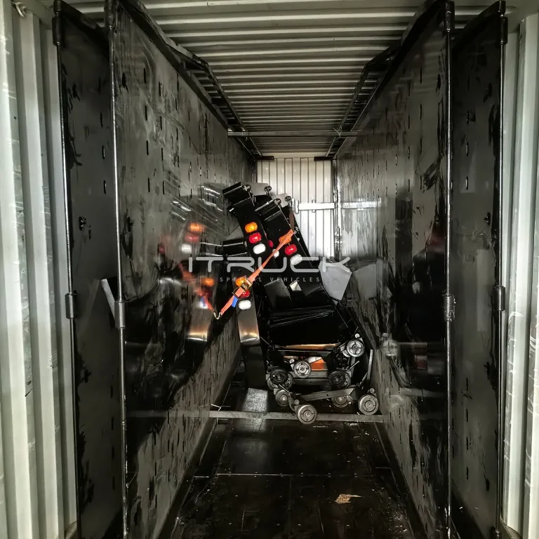 Flatbed decks loaded upright in a 40 ft container