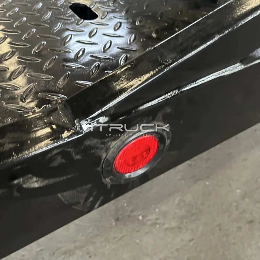 Checkered deck plate and side marker light close-up