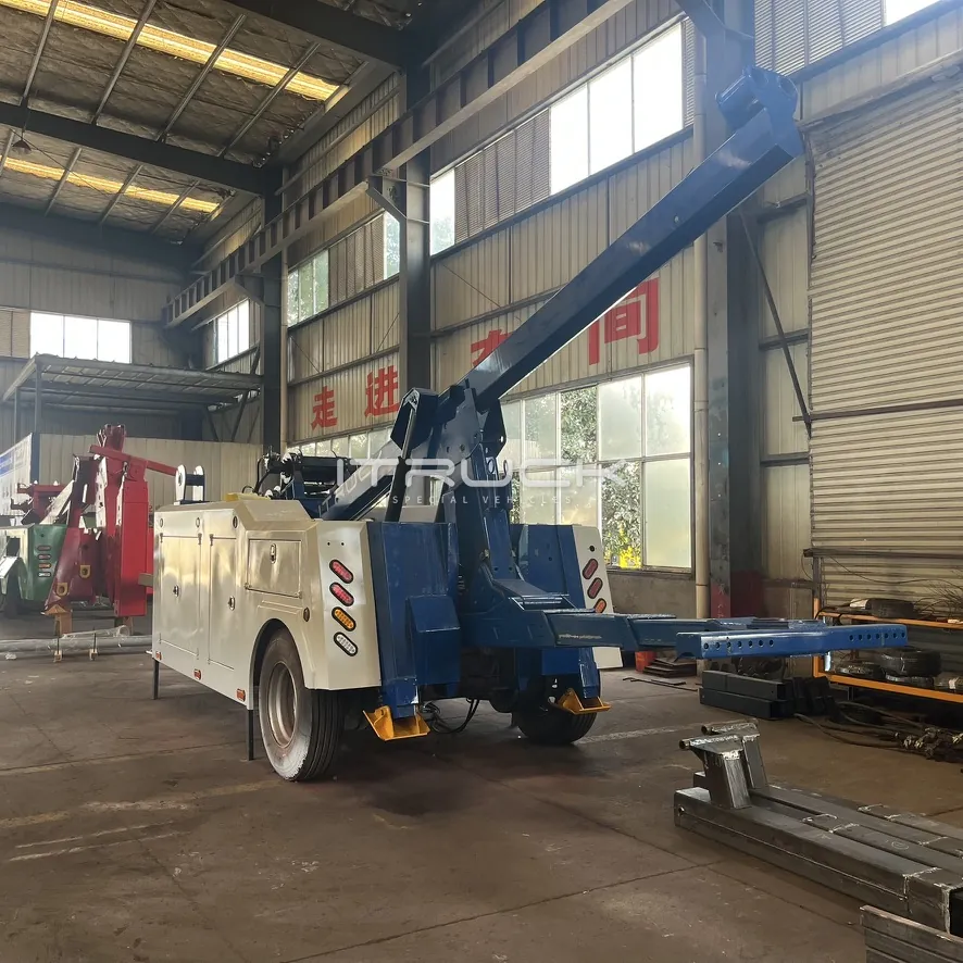 Blue and white integrated wrecker on chassis with underlift extended