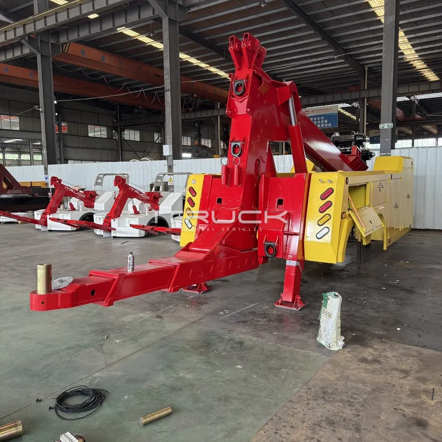 Red boom and extended underlift on a yellow wrecker body