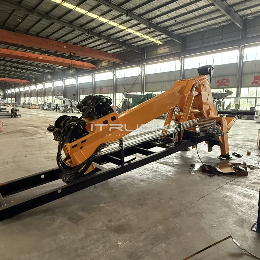 Yellow boom and subframe with twin winches and hydraulic hoses