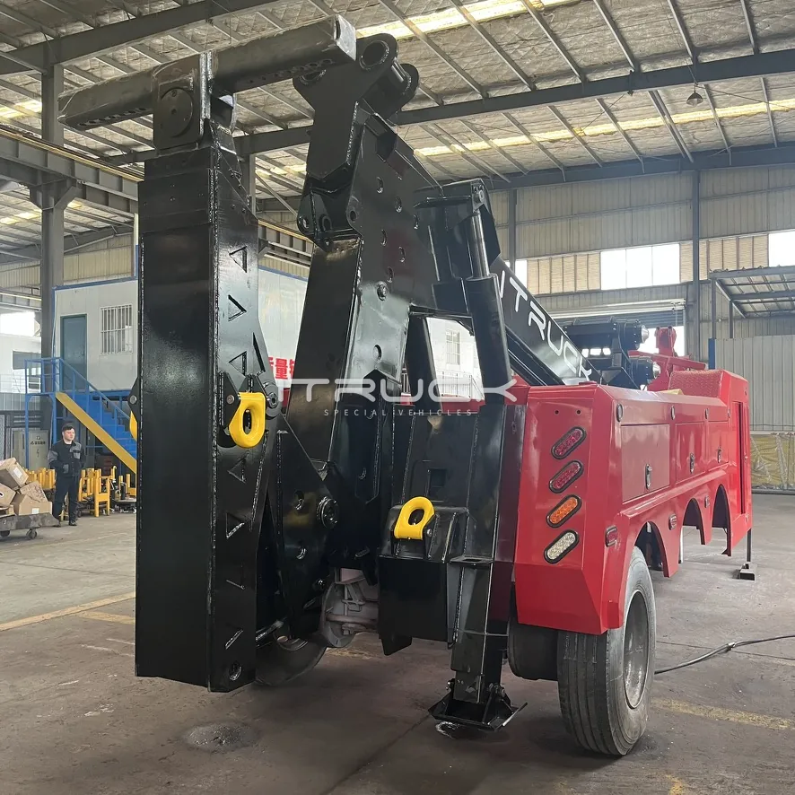 Rear quarter of heavy wrecker with stabilizer legs and tow hooks