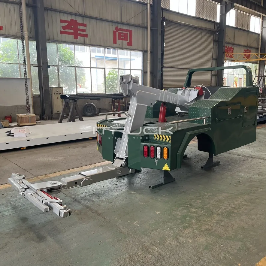 Green mini integrated wrecker body with folding underlift extended
