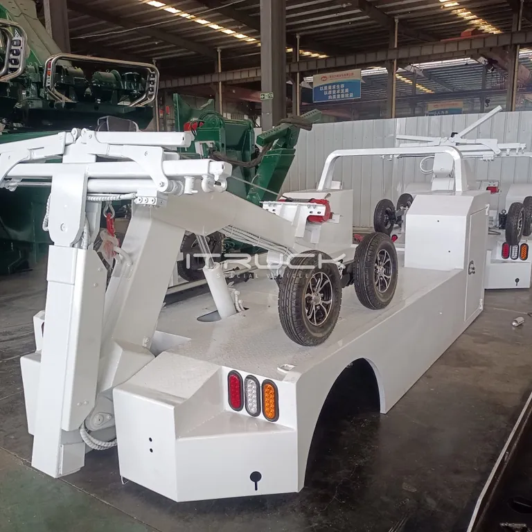 White mini integrated wrecker body with support wheels on deck