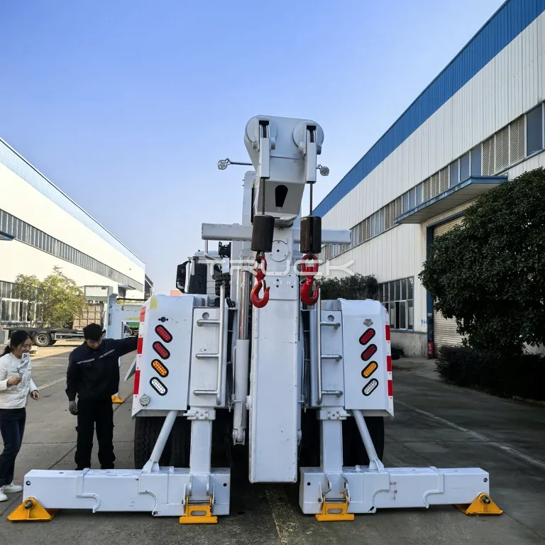 Straight rear view of rotator with outriggers spread wide