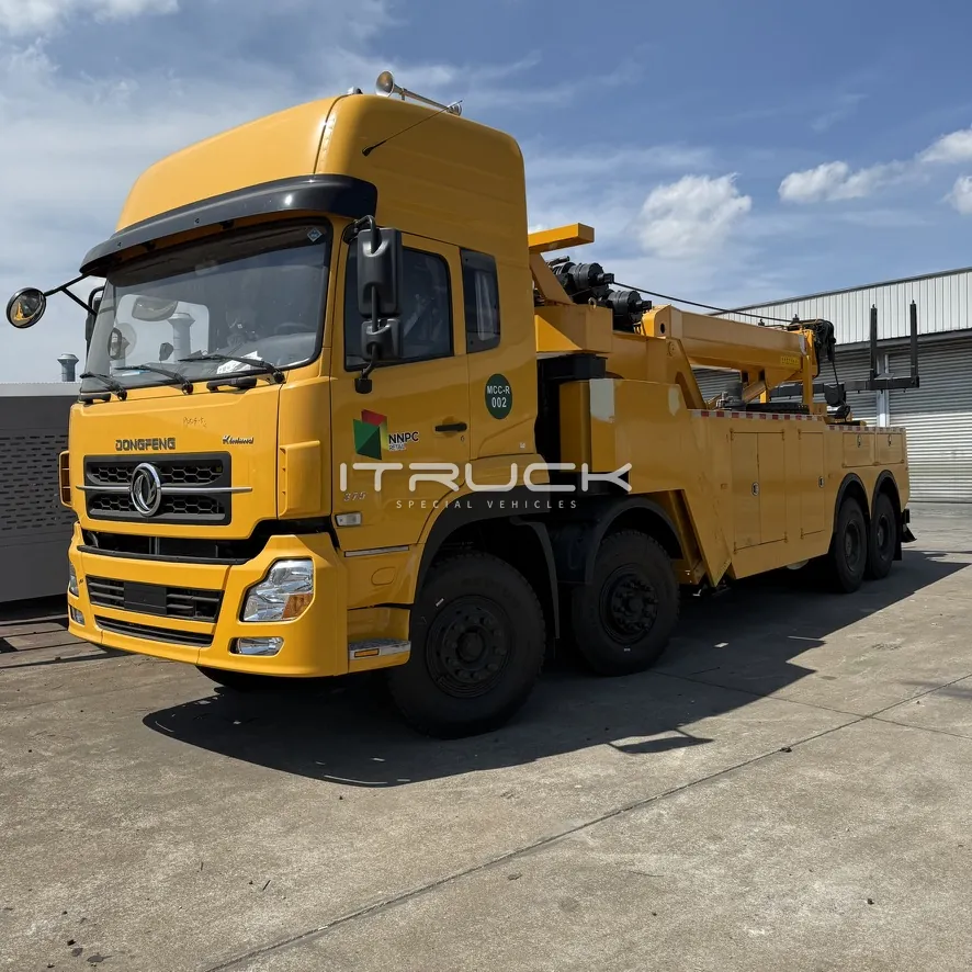 Yellow rotator wrecker front quarter view with boom stowed