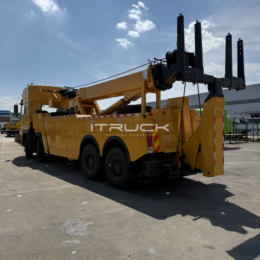 Yellow rotator wrecker rear quarter from the passenger side