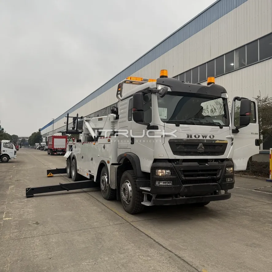 White 50 ton rotator wrecker on an eight-wheel chassis, front view