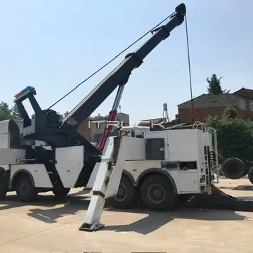 Rotator boom swung to the side lifting a load behind the truck