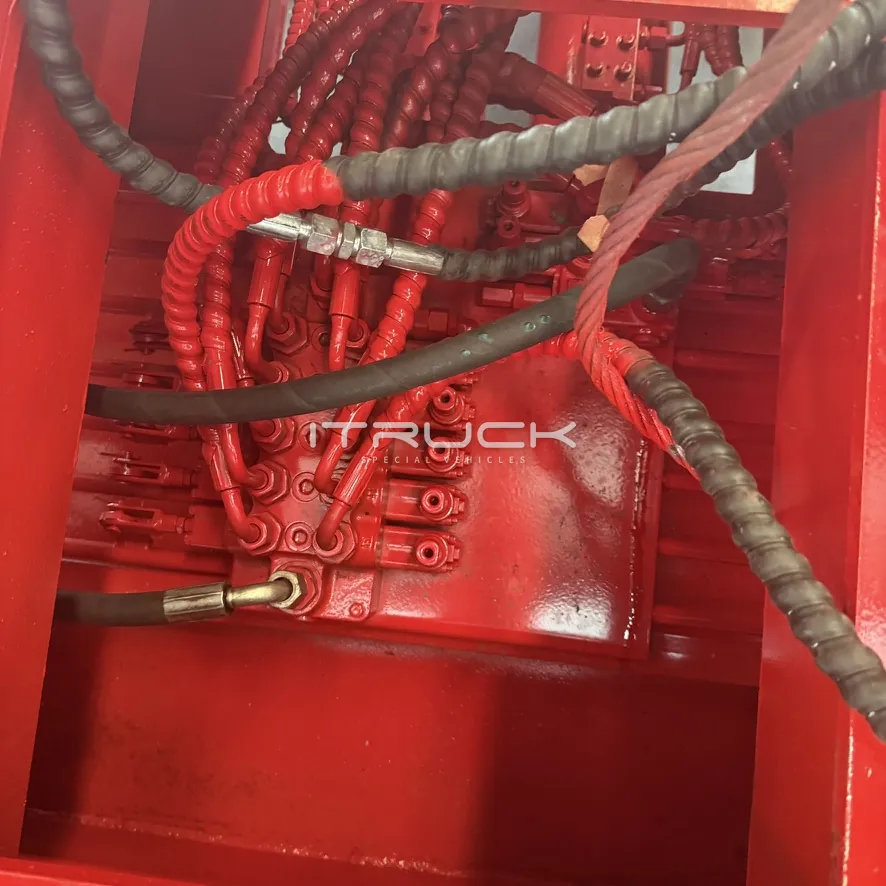 Hydraulic hoses and fittings inside the underlift housing