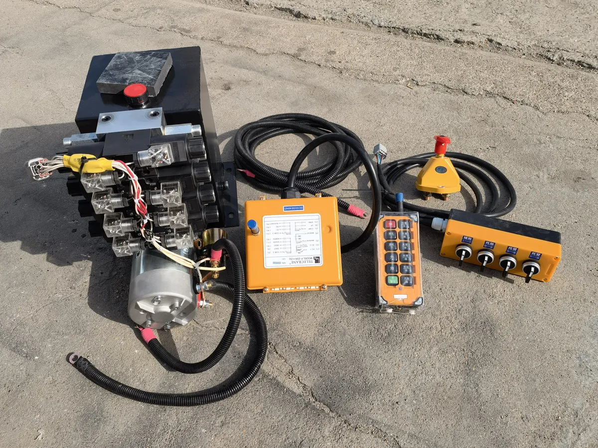 Hydraulic power unit — tank and motor, valve bank, wireless receiver and remote, manual lever box, battery isolator and loom